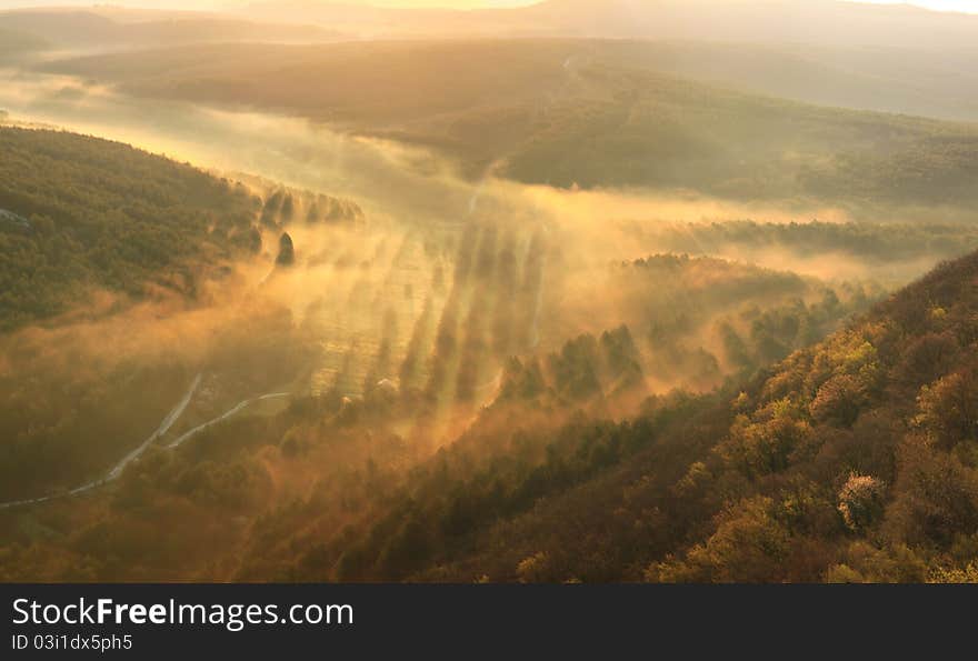 Misty mountains on summer sunset