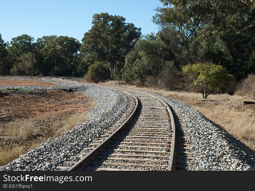 A winding railway line heading out of town. A winding railway line heading out of town