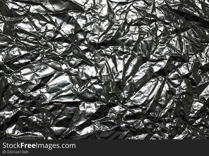 Foil background and texture silver paper with wrinkled