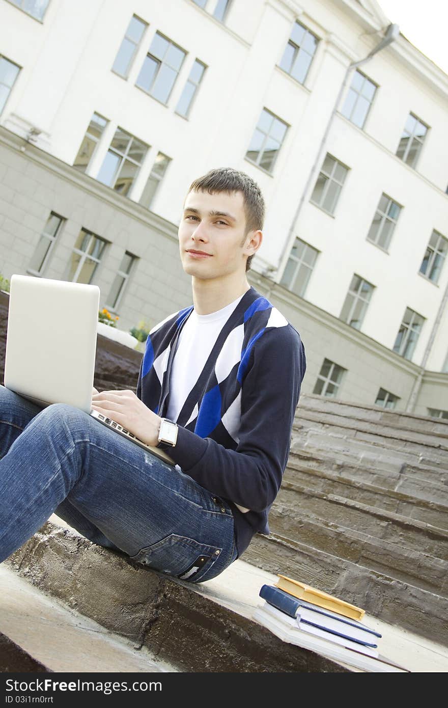 Young Student Working On A Laptop