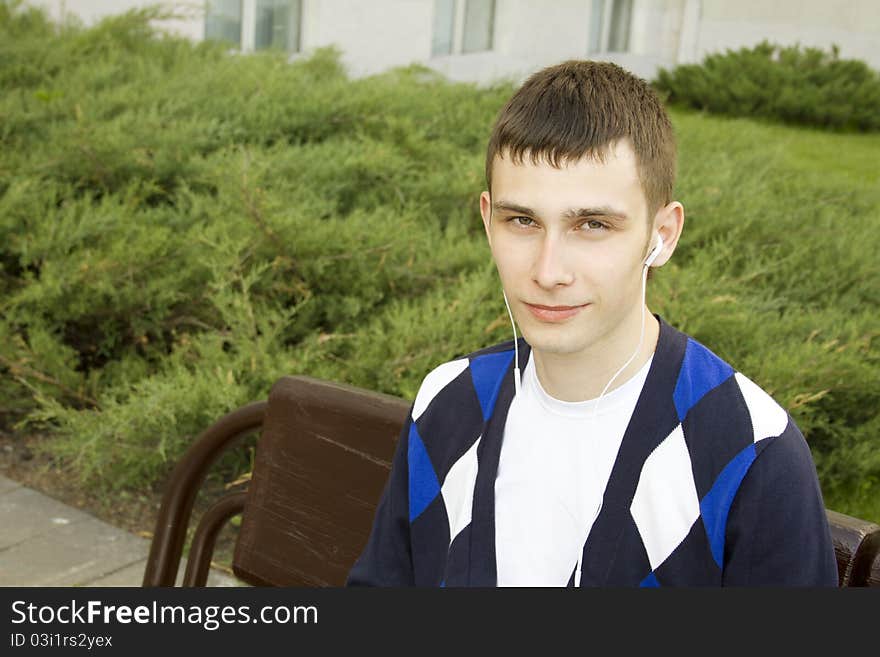 Closeup Of A Young Male Student In The Headphones