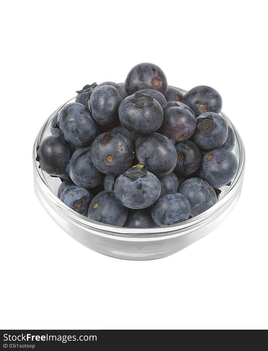 A bowl of fresh blueberries, isolated on a white background. A bowl of fresh blueberries, isolated on a white background