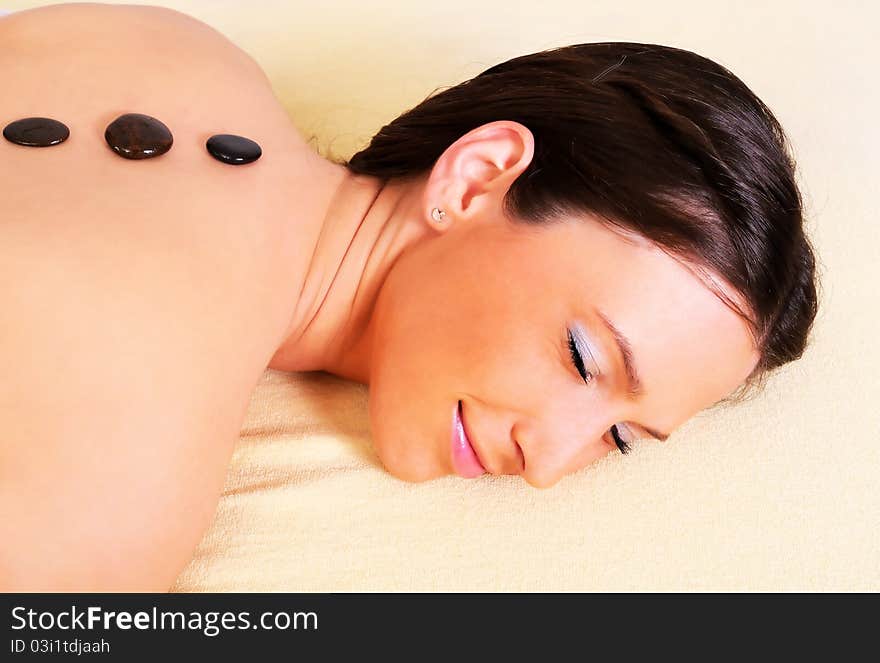 Young beautiful woman getting relaxing  in spa