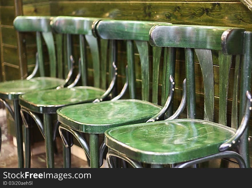 Green wooden chairs in the cafe. Green wooden chairs in the cafe.