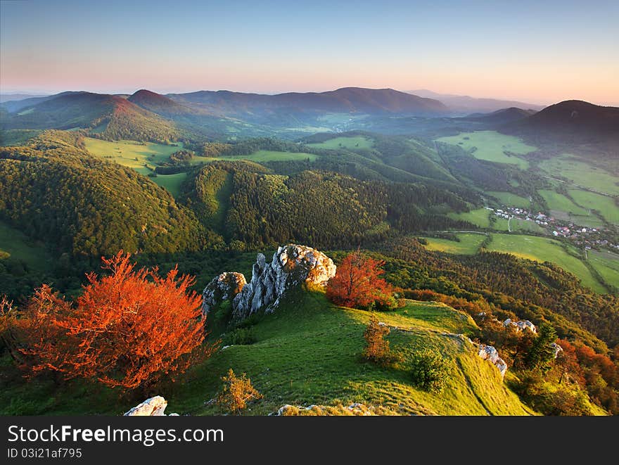 Landscape with rocky mountains at sunset