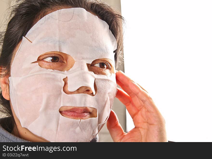 Chinese woman wearing a facemask. Close up