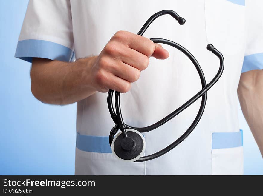 Stethoscope in hands of doctor