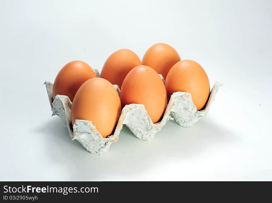 Cardboard packaging from 6 eggs isolated on white background.