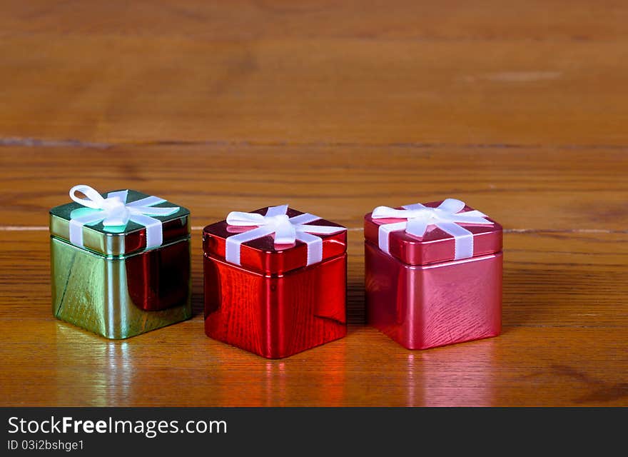 Tin Christmas boxes on old vintage table