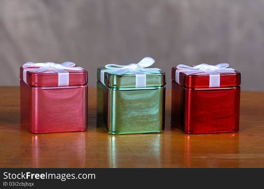 Tin Christmas boxes on old vintage table