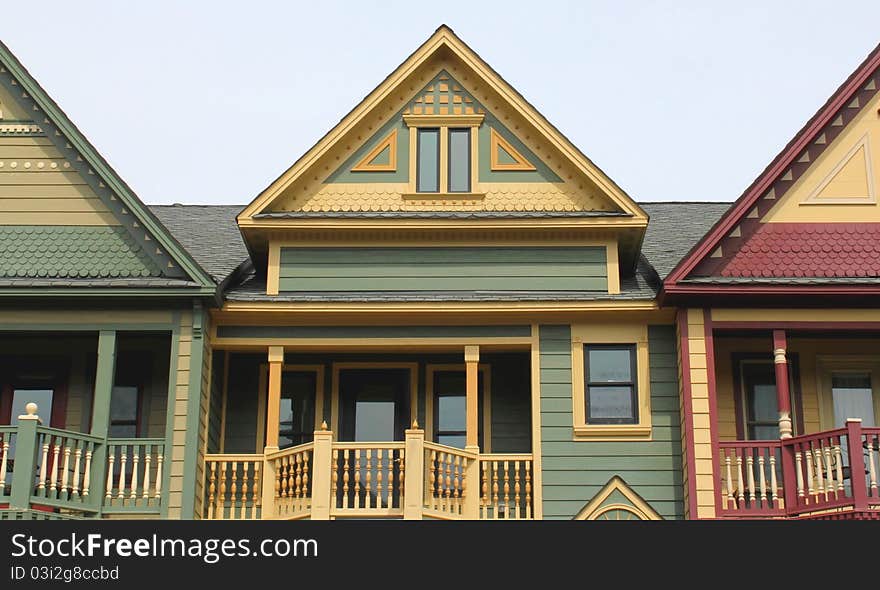 Victorian style house tops against a clear sky