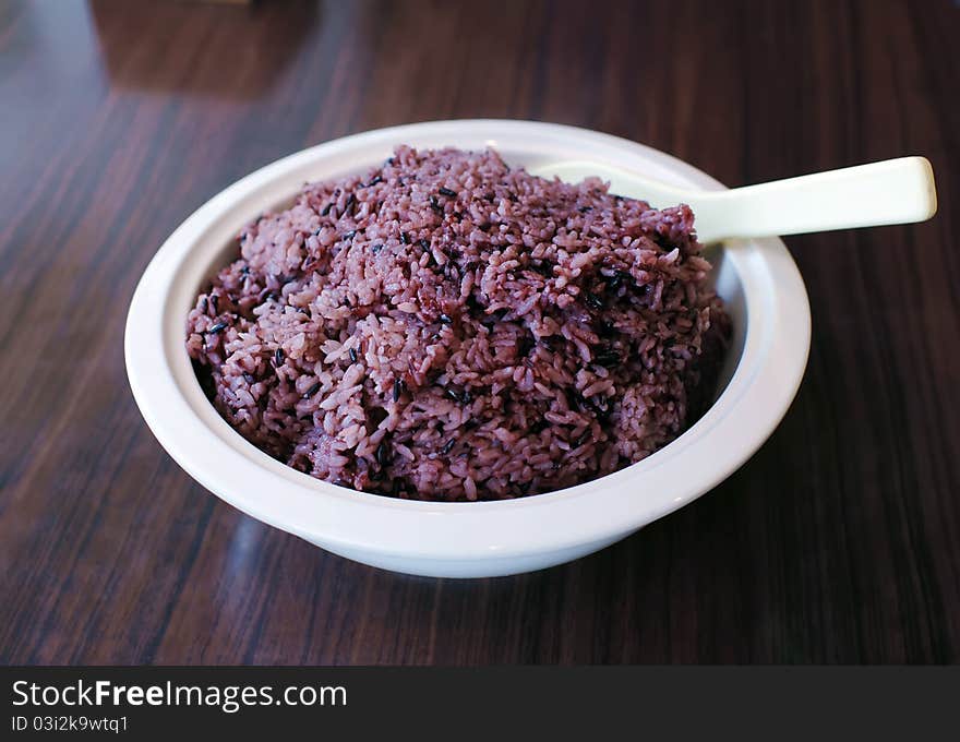 Black sticky rice in white round bowl