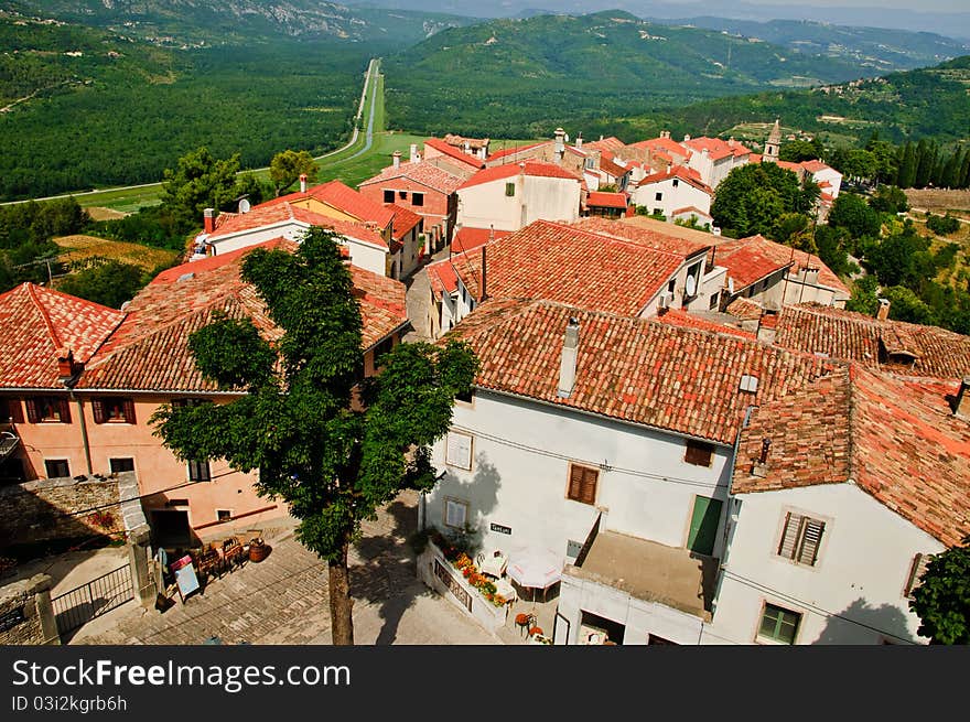 Hill top town in Croatia showing red roofs of old buildings