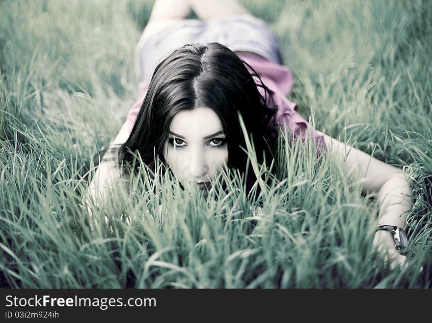 Beautiful Girl lying on the grass