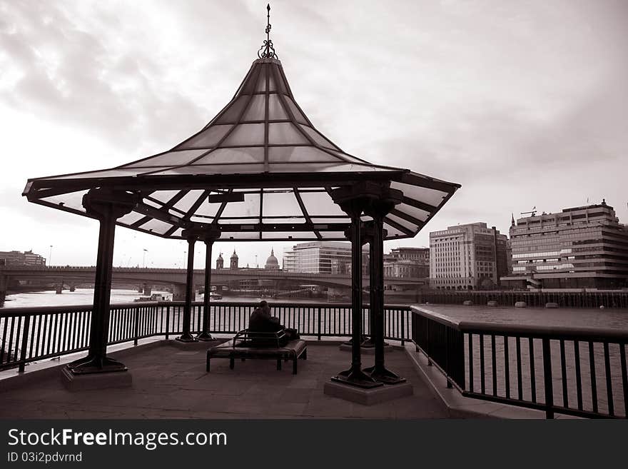 Couple looking at London Bridge and the River Thames in London, England, UK