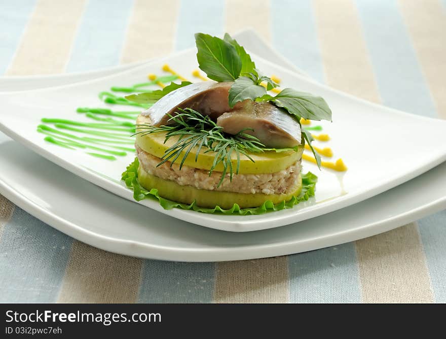 Appetizer of herring with apples with greens. Appetizer of herring with apples with greens