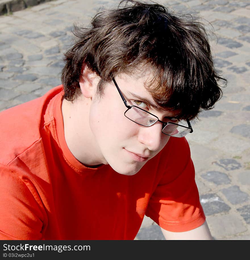 Young man with glasses smiling