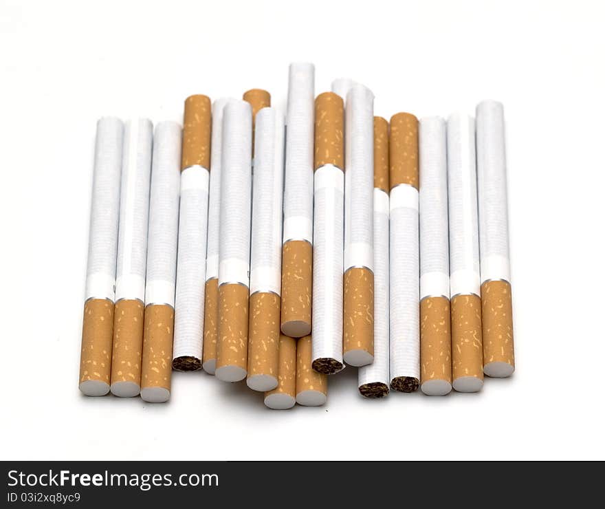 A lot of cigarettes isolated on white. A lot of cigarettes isolated on white