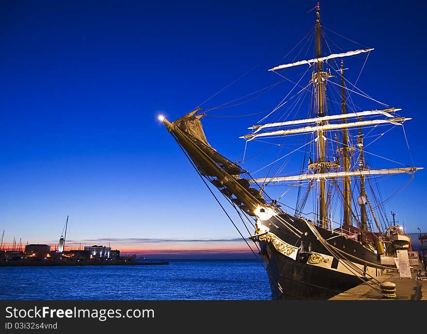 Moored sailing ship at sunset. Moored sailing ship at sunset