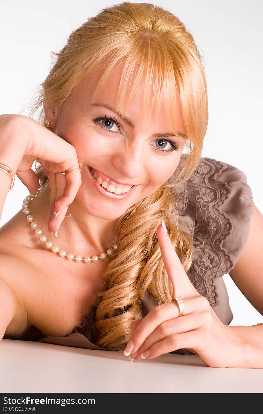 Nice blonde girl posing on a white background