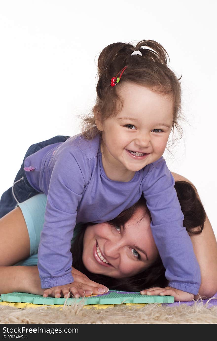 Mom and her baby playing on carpet. Mom and her baby playing on carpet