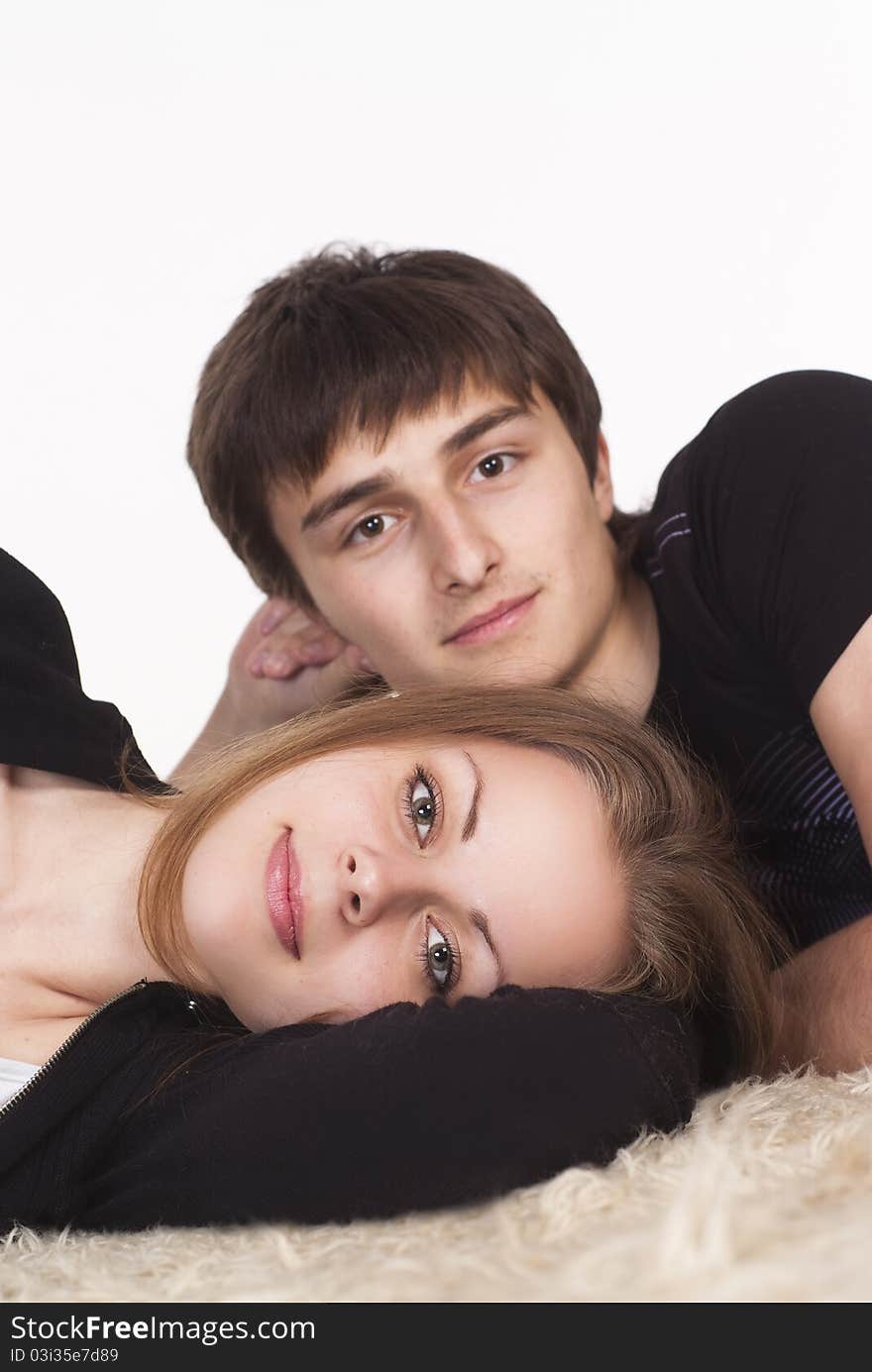 Portrait of a cute young couple on carpet. Portrait of a cute young couple on carpet