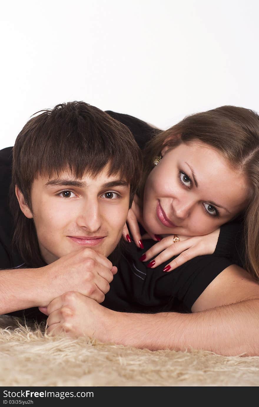 Portrait of a cute young couple on carpet. Portrait of a cute young couple on carpet