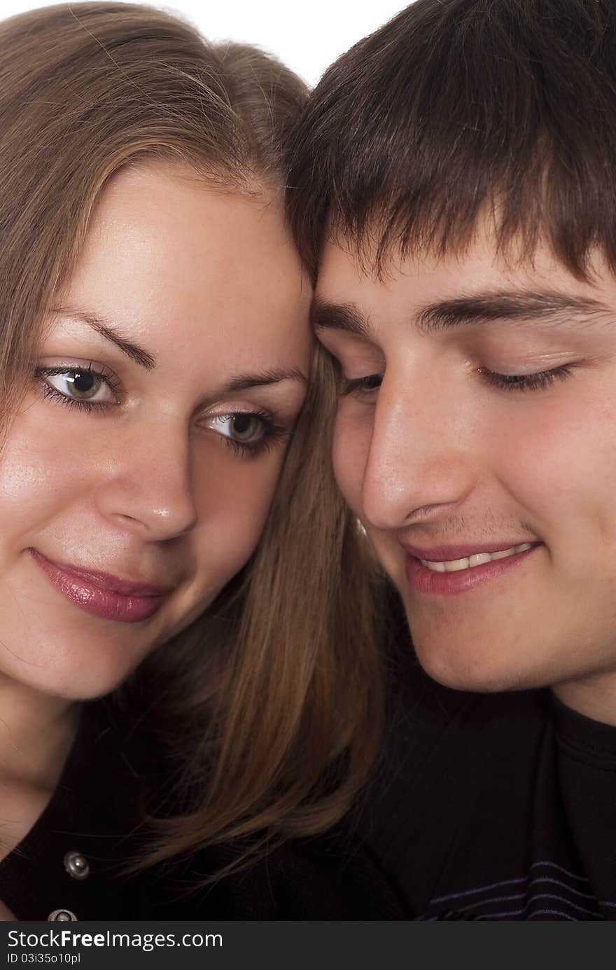 Portrait of a cute young couple on a white background. Portrait of a cute young couple on a white background