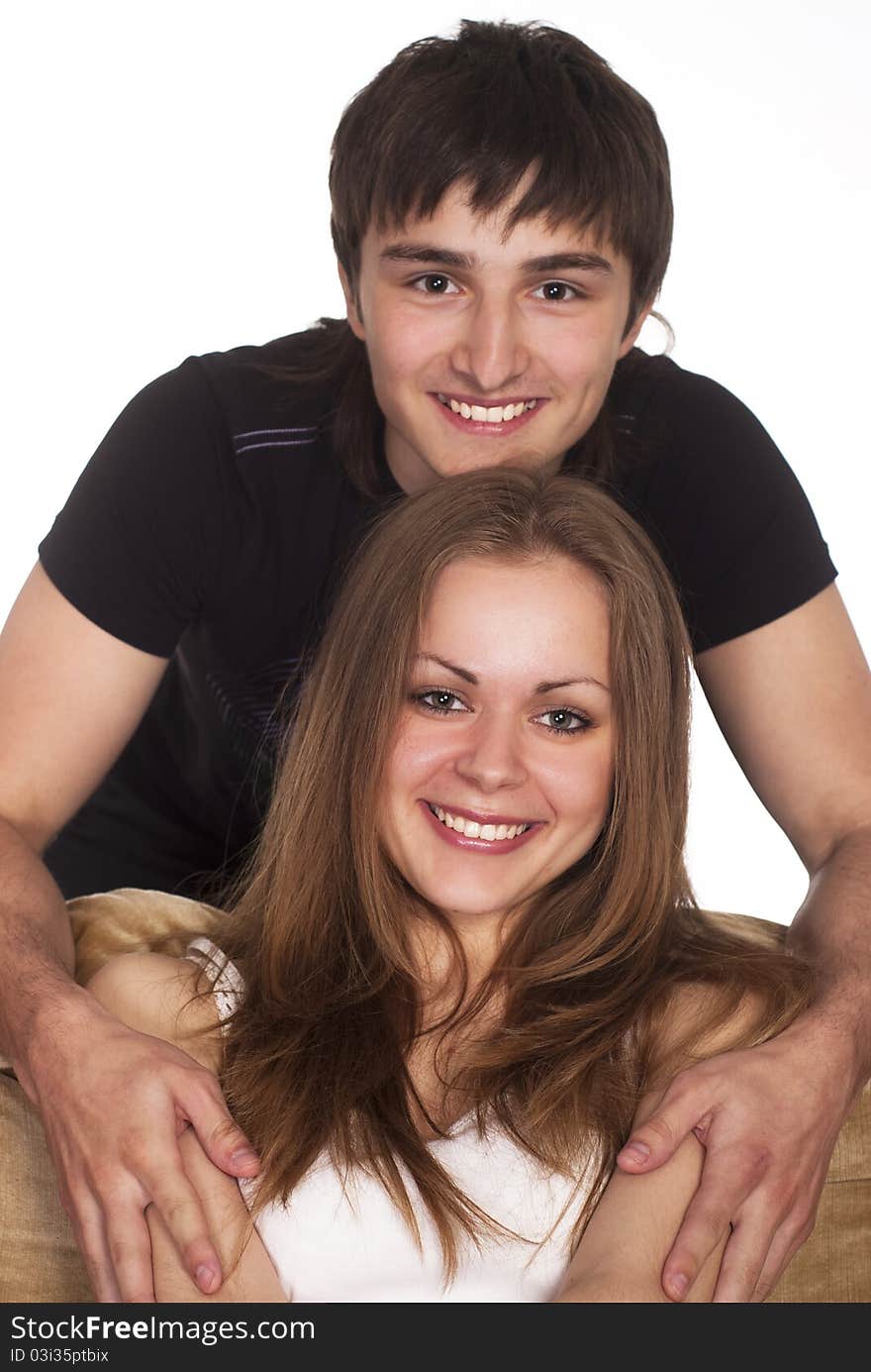 Portrait of a cute young couple on sofa. Portrait of a cute young couple on sofa