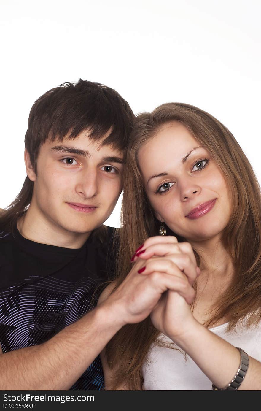 Portrait of a cute young couple on a white background. Portrait of a cute young couple on a white background