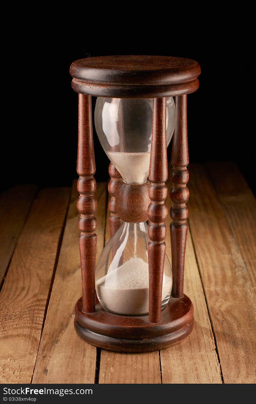 Hourglasses on a wooden surface