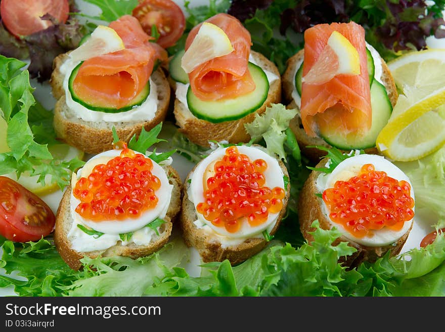 Red caviar and salmon sandwiches. Red caviar and salmon sandwiches