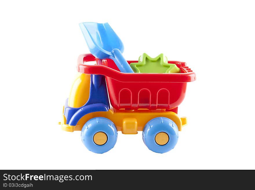 Big Colorful Toy Truck on a white background with children with shovels. Big Colorful Toy Truck on a white background with children with shovels