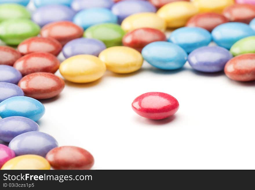 Round red candy isolated from other colorfull candys. Round red candy isolated from other colorfull candys