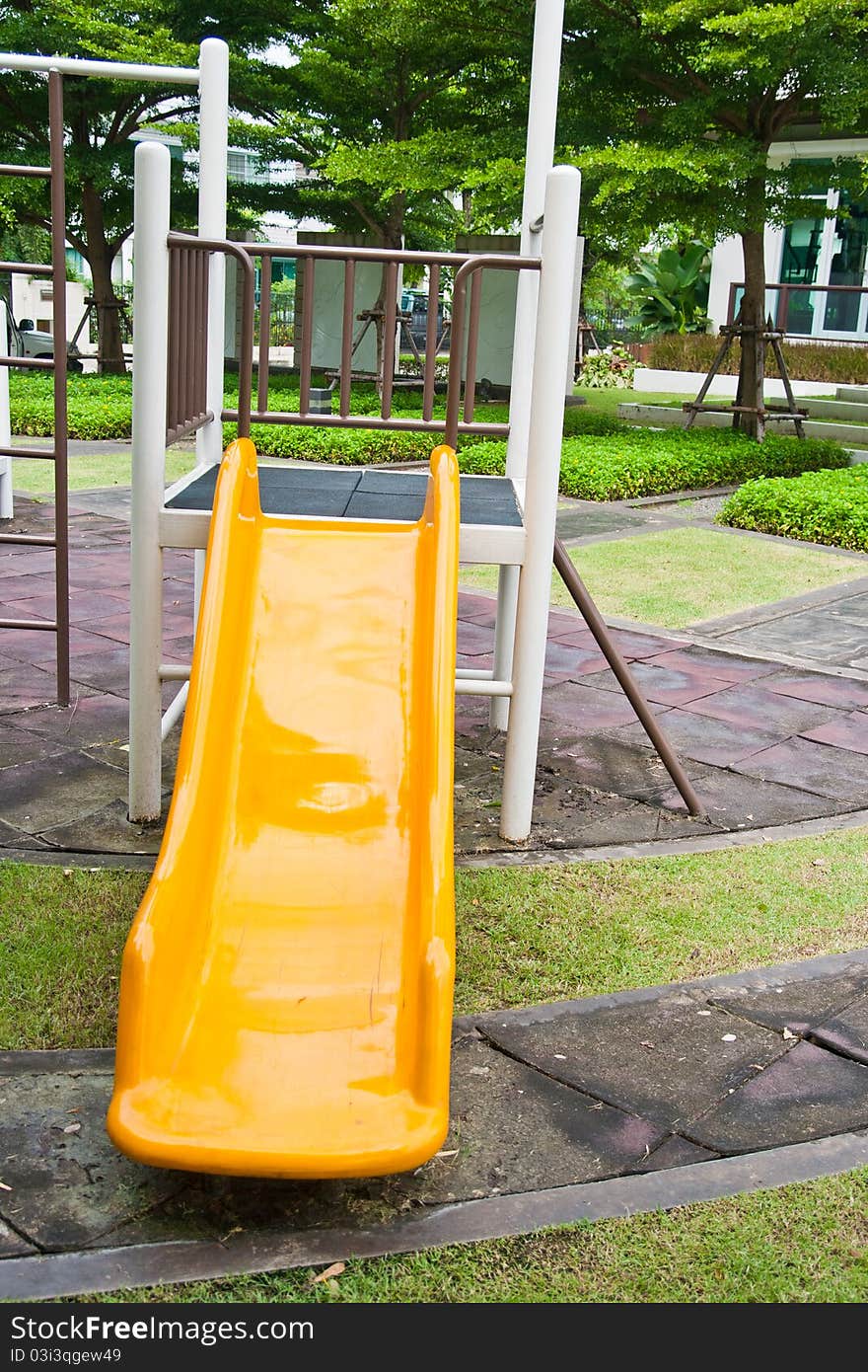 Yellow toy playgroud in garden