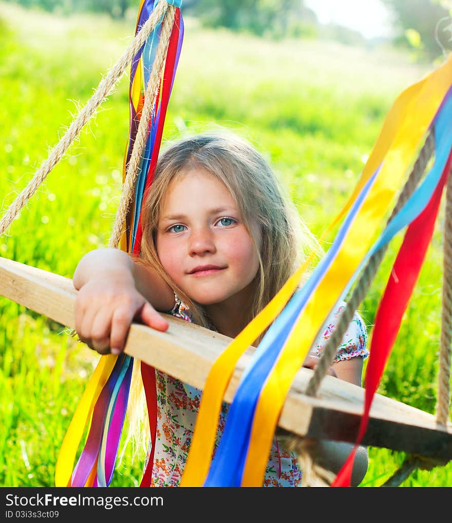 Young girl on swing