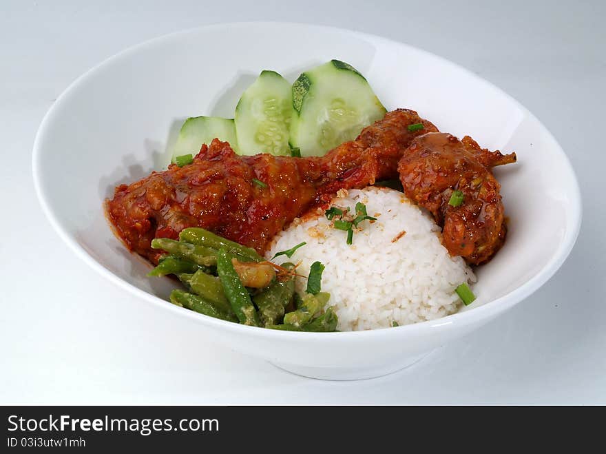 A plate of Curry chicken rice close up