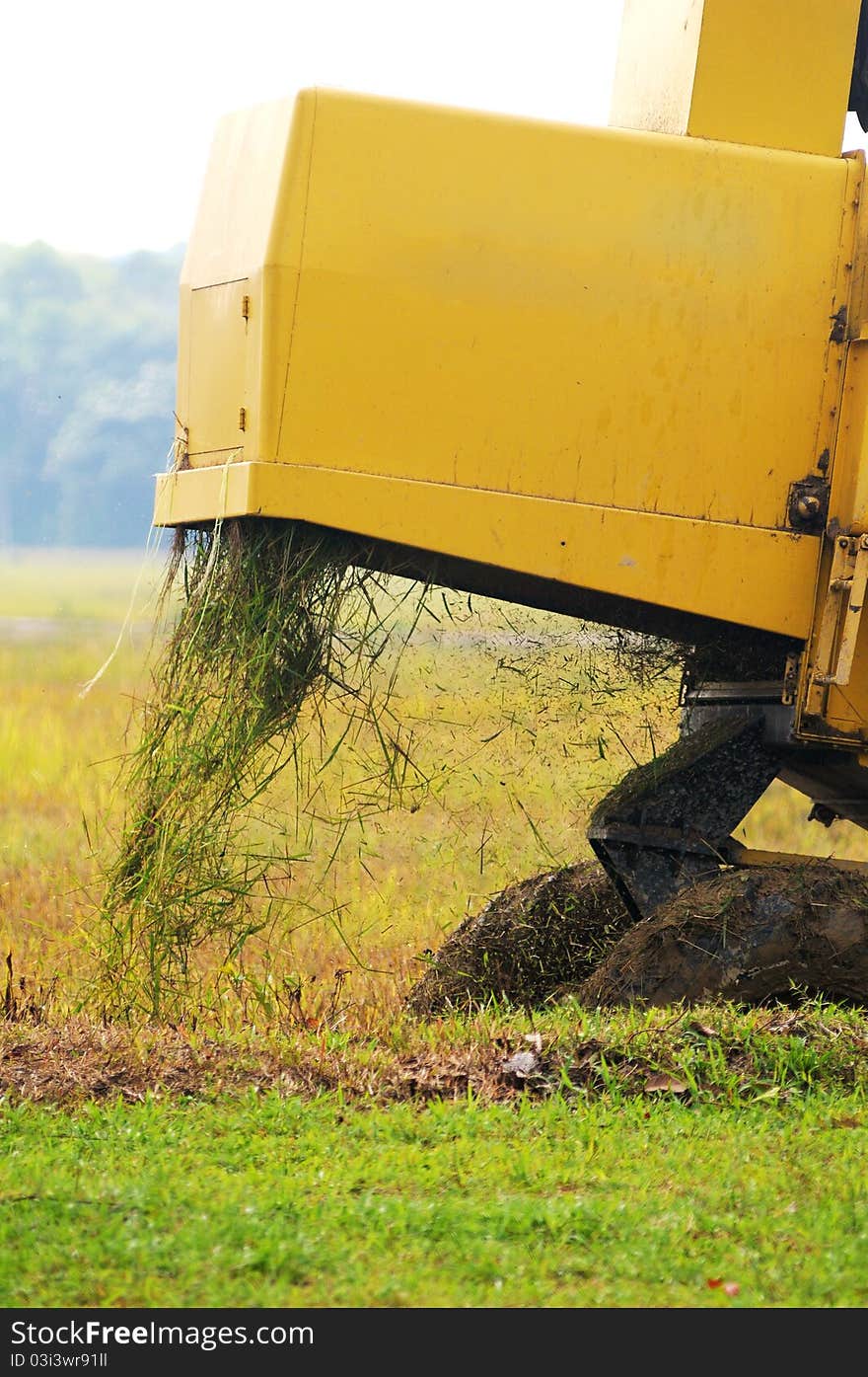 Close up of paddy harvest machine from back