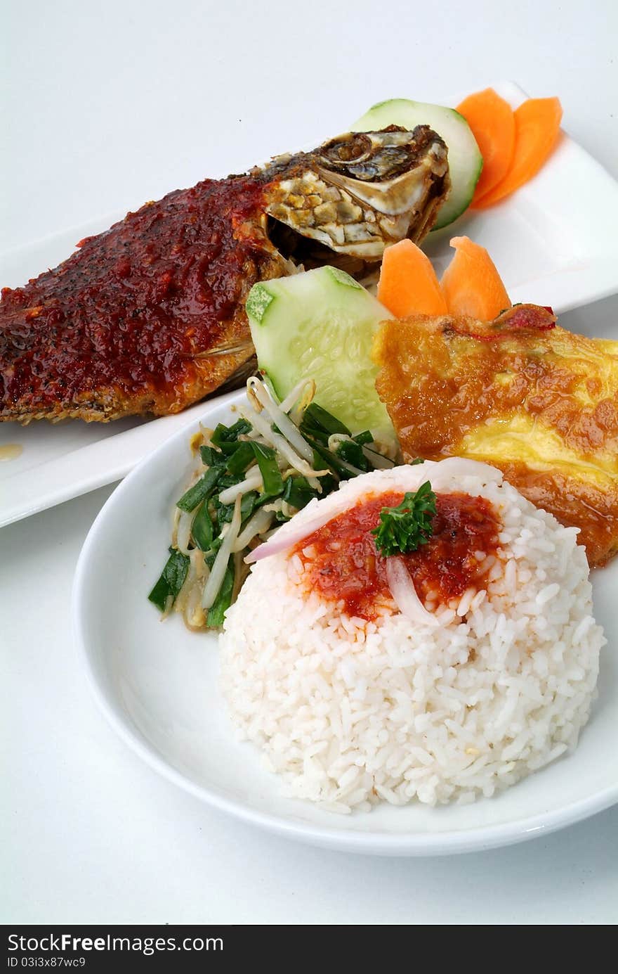 Rice with spicy fish curry and vegetables. Rice with spicy fish curry and vegetables