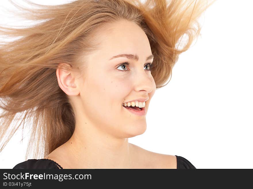 Joyful young woman with waving hair