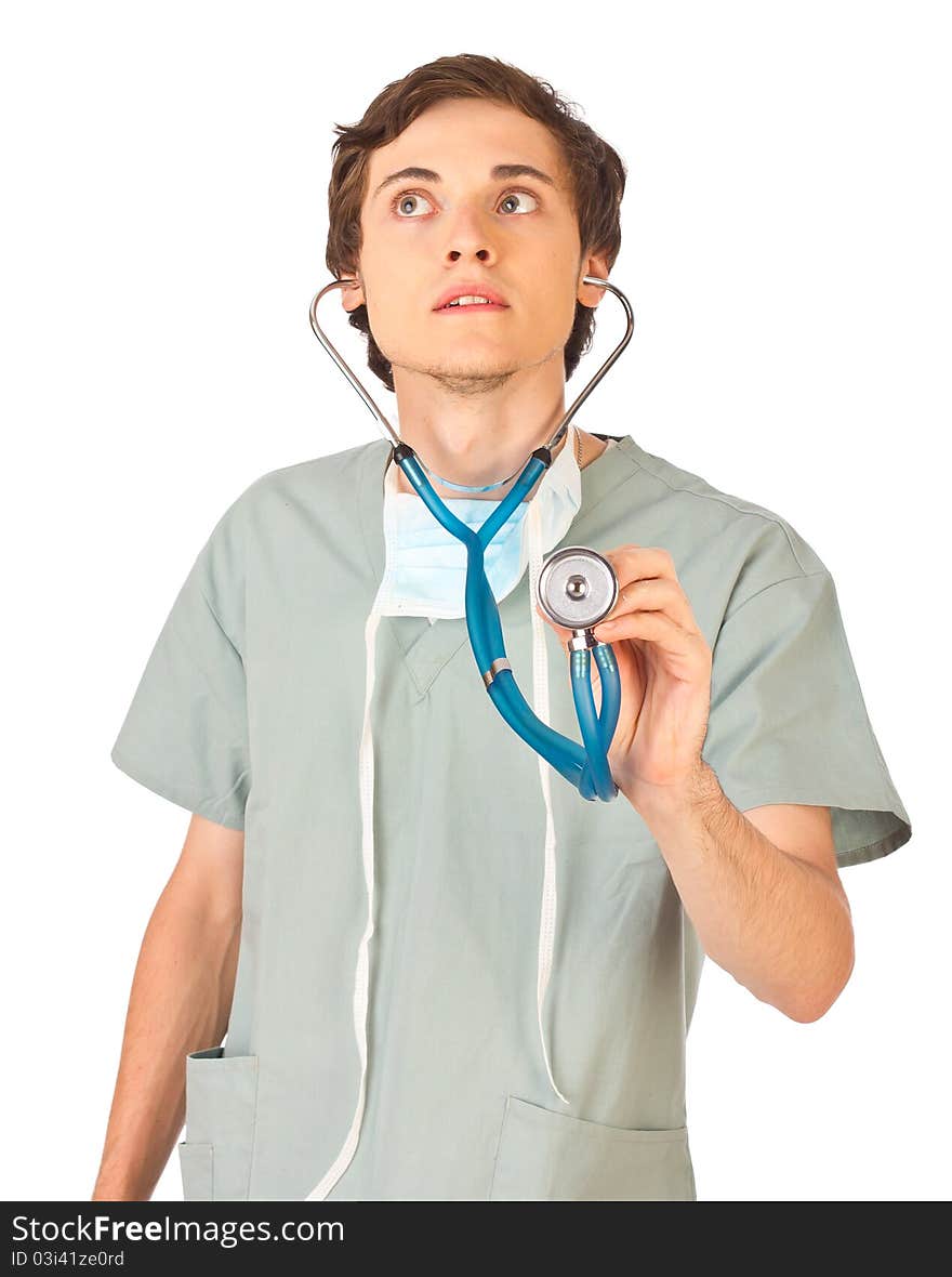 Young doctor standing and listening to stethoscope. Young doctor standing and listening to stethoscope