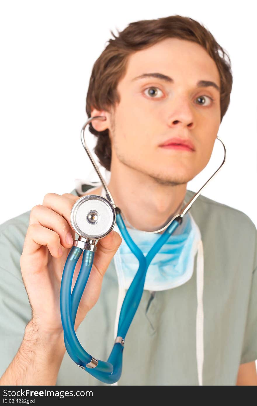 Young doctor listening to stethoscope close up. Selective focus.