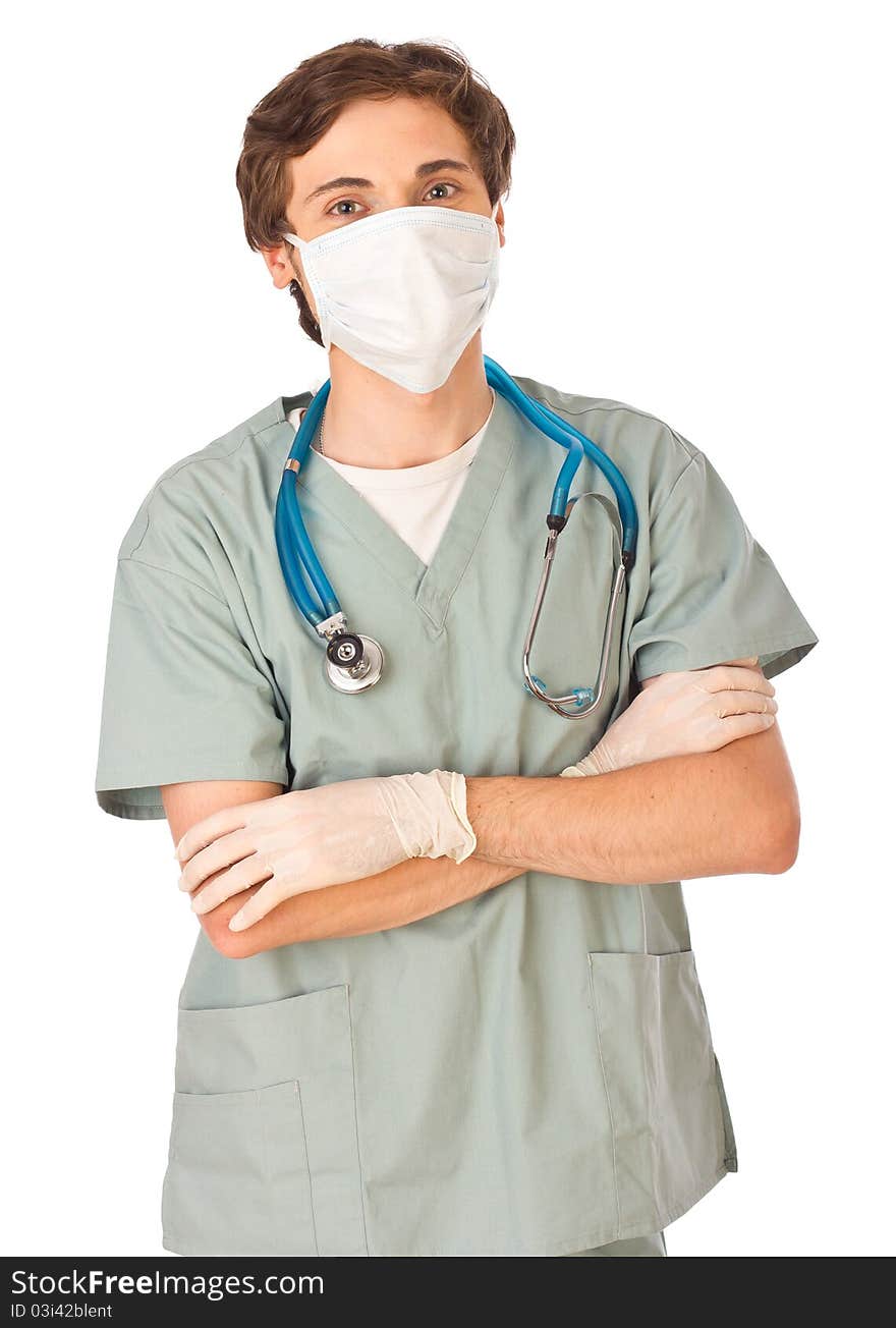 Attractive young male doctor standing with arms locked and looking straight in camera. Attractive young male doctor standing with arms locked and looking straight in camera