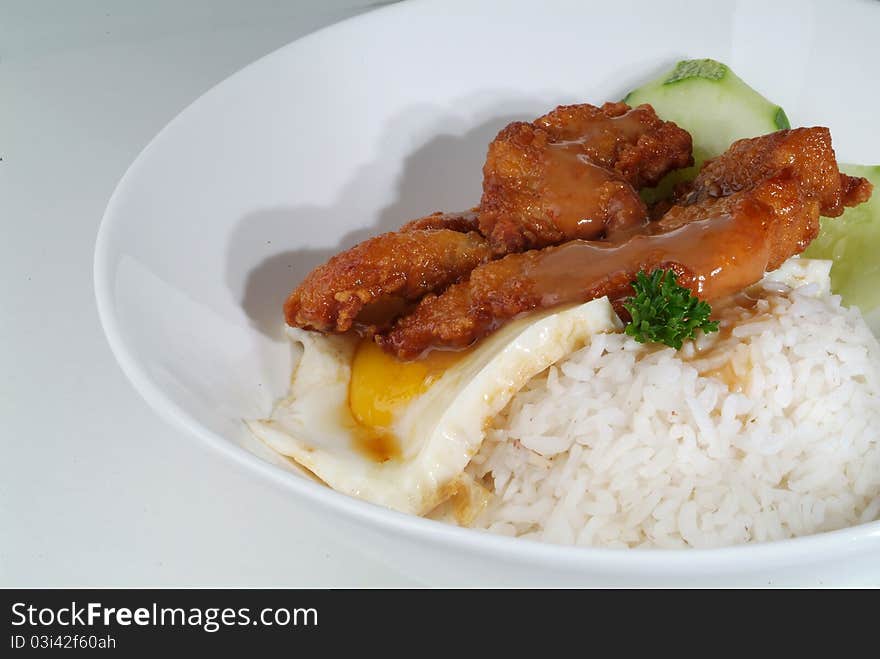 Fried meat serve with white rice. Fried meat serve with white rice