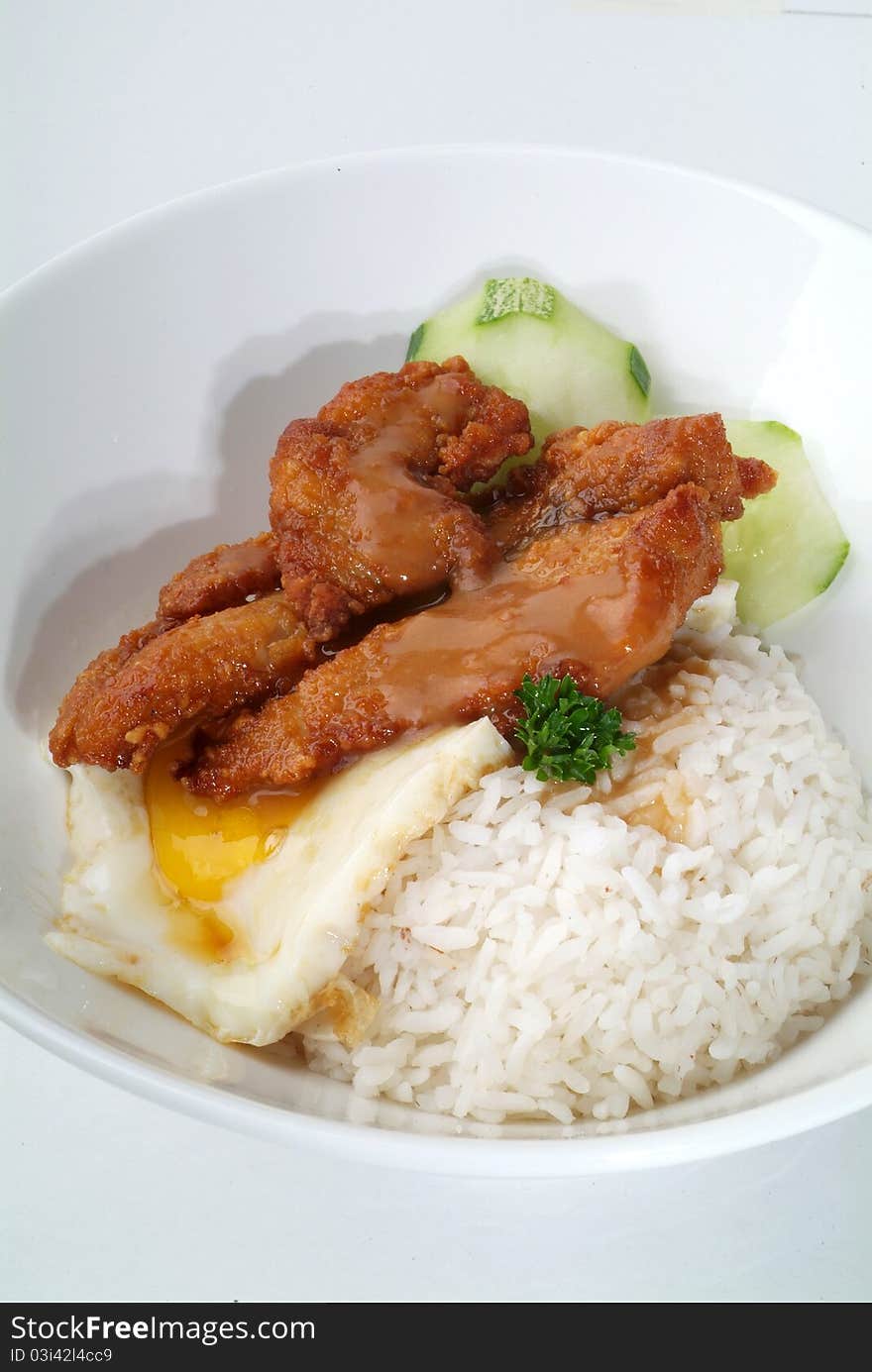 Fried meat serve with white rice. Fried meat serve with white rice