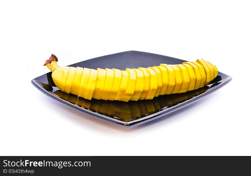 Banana on a plate. Objects on a white background.