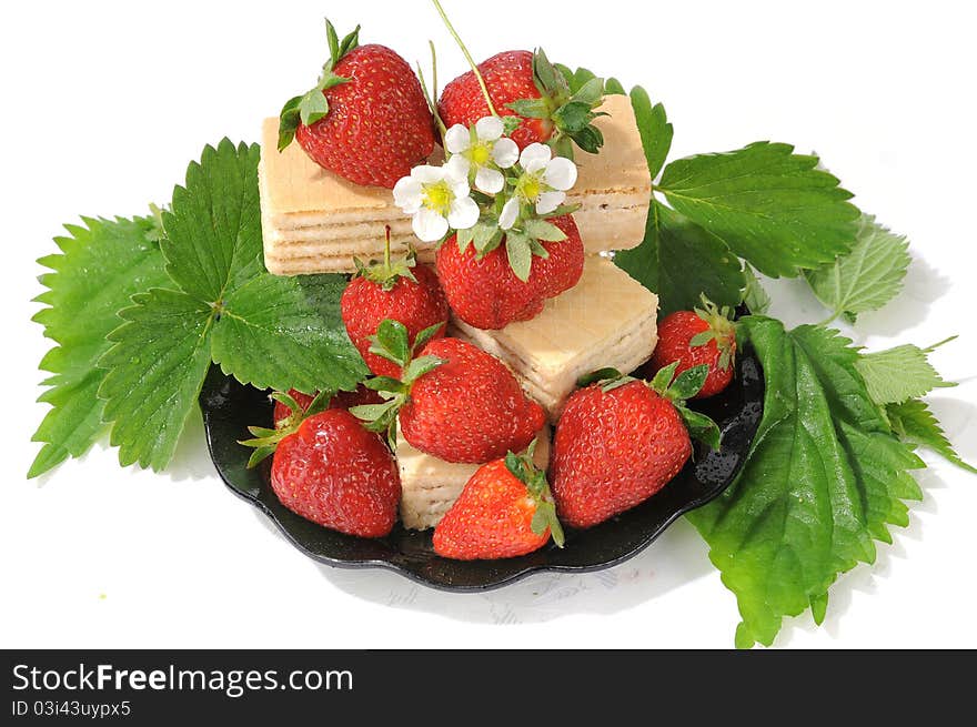 Dessert for a dinner - a strawberry and tasty wafers. Dessert for a dinner - a strawberry and tasty wafers.