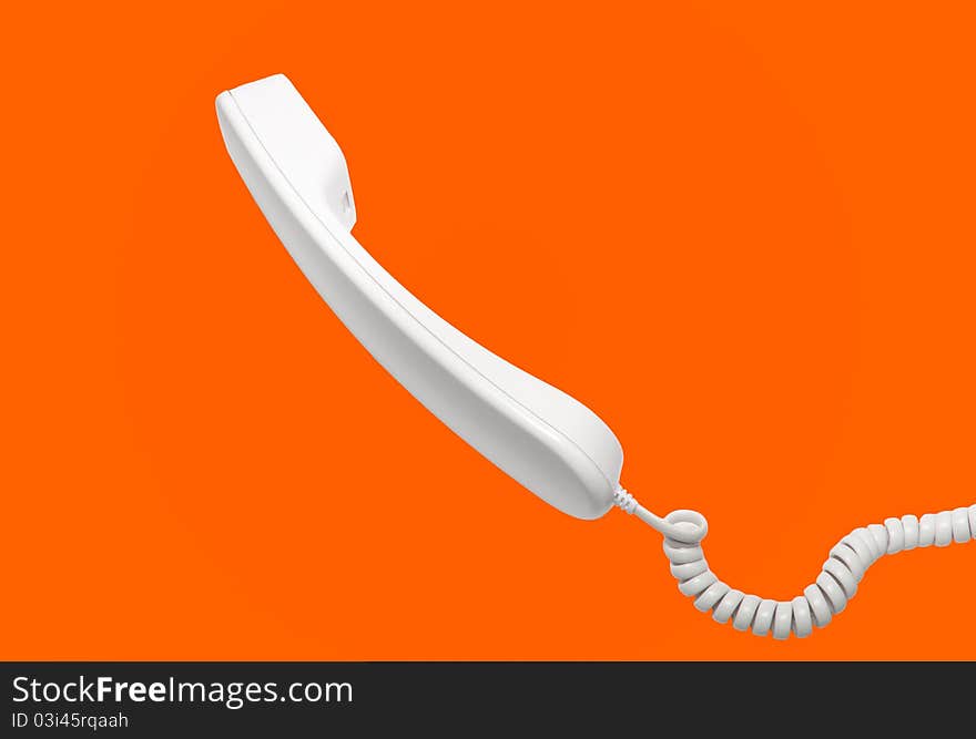 Handset with a wire on an orange background