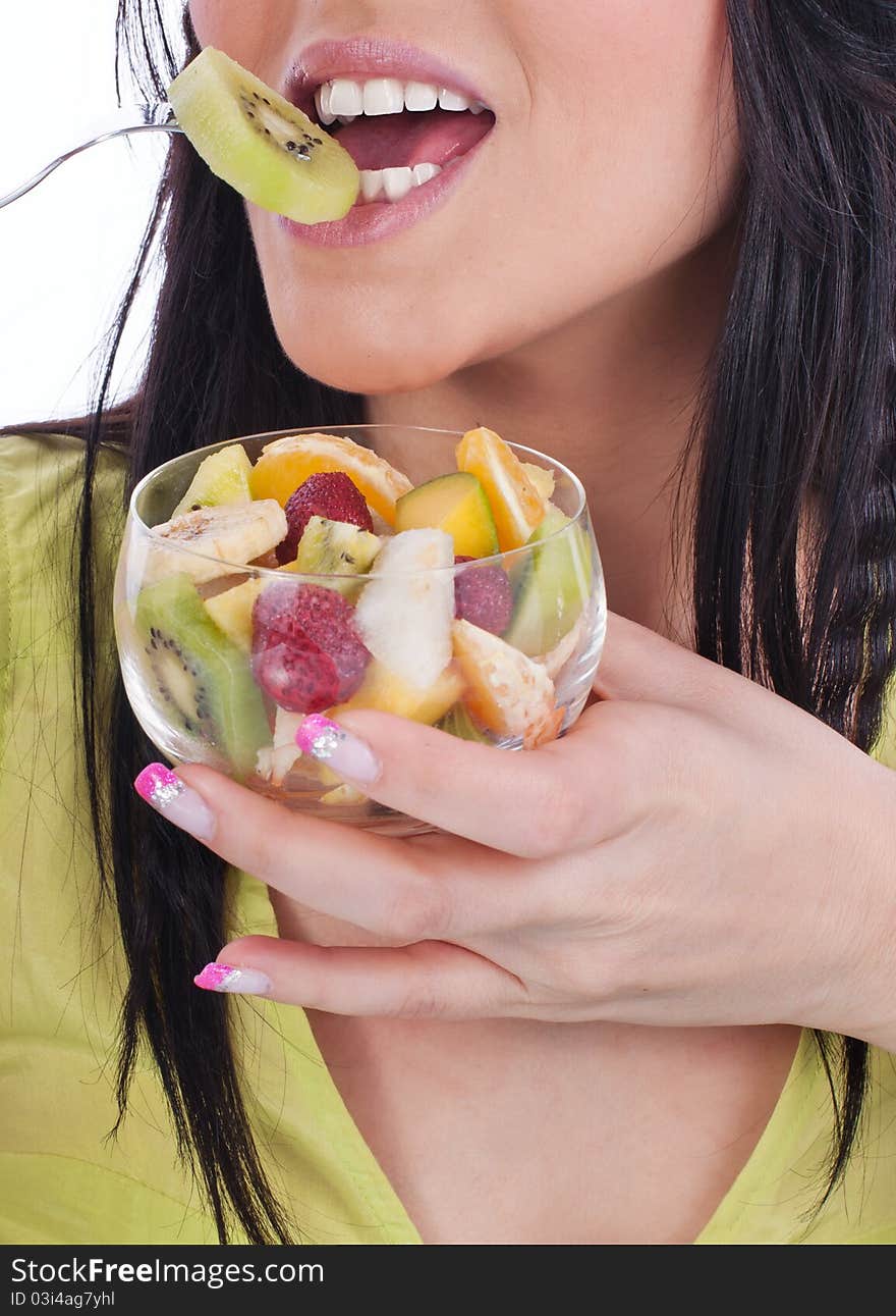 Women with fruit salad, isolated - studio shot