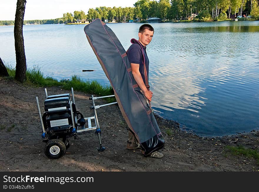 Going angler with the entire fishing accessories to the position